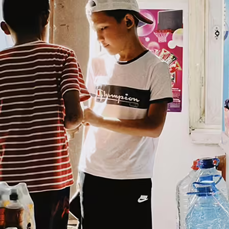 Two teen boys in a store