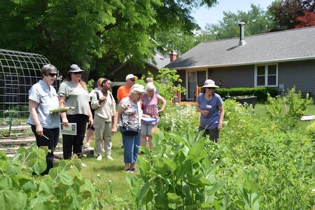 community members touring a garden